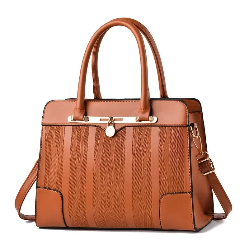 Bolsa feminina laranja com alça confortável e acabamento couro
