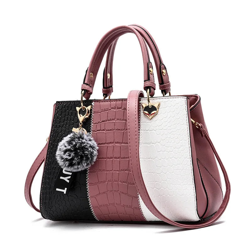 Bolsa feminina rosa com alça fixa e acabamento elegante
