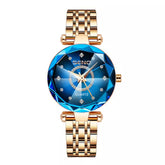 Relógio Feminino Ocean Majestic com pulseira de aço inox, cor azul dourado e resistência à água
