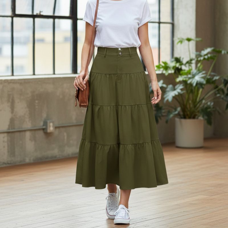 alt="Saia midi feminina verde evasê urbana estilosa um visual moderno"